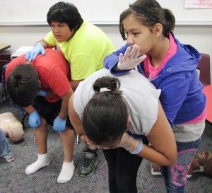 Red Lake, MN, fifth-graders learn skills to save a choking victim during an American Red Cross Babysitter's Training class on June 20, 2013.