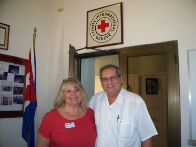 Red Cross volunteer Kathryn Schmidt (l) and Dr. Luis Foyo Ceballos, Director of the Cuban Red Cross (r) in Havana, April 2014. Photo provided courtesy of the author.