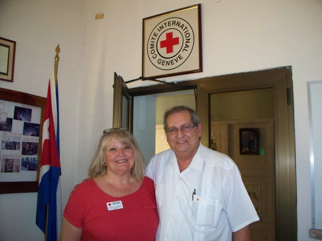Red Cross volunteer Kathryn Schmidt (l) and Dr. Luis Foyo Ceballos, Director of the Cuban Red Cross (r) in Havana, April 2014. Photo provided courtesy of the author.