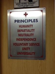 The global Red Cross Red Crescent 7 fundamental principles posted at the Indian Red Cross Society, Karnataka Branch, 2014. Photo credit: Craig Yolitz.