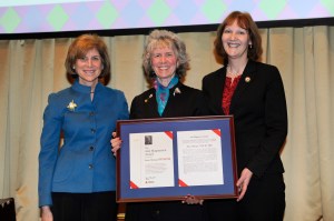 Janice Springer (c) receives the Ann Magnussen Award from Gail McGovern (l) and Linda MacIntyre (r) during the American Red Cross National Awards and Recognition Dinner on February 18, 2015, in Washington D.C. Photo by Jason Colston/American Red Cross